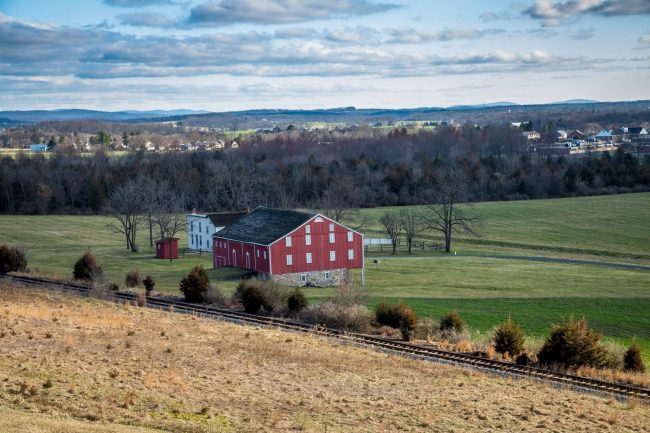 Canva – Red And Grey House In The Middle Of Green Grass Field